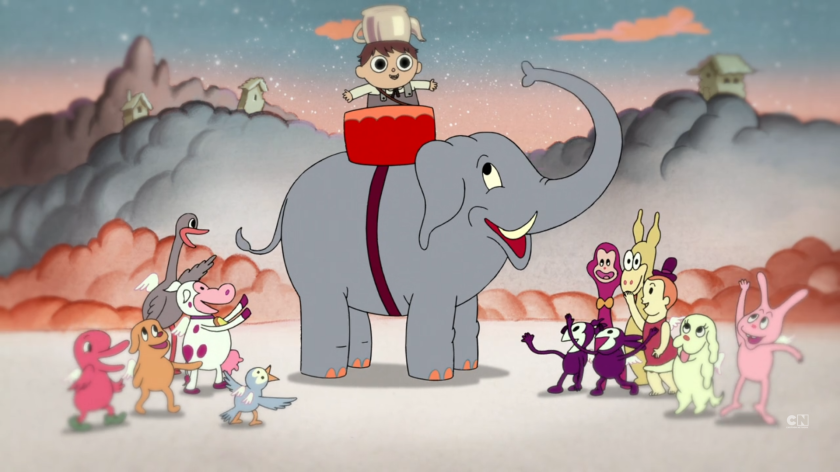Greg wears a cauldron on his head and stands on an elephant while being dressed as an elephant in Cloud City