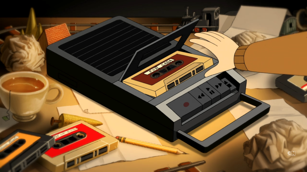 A black train can be seen on Wirt's desk as he grabs the mixtape for Sara
